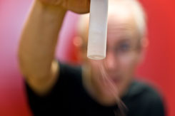 David Turton holding a vial of frozen glassy salt solution – (c) 2008 Klaas Wynne, University of Strathclyde, Physics Department, SUPA