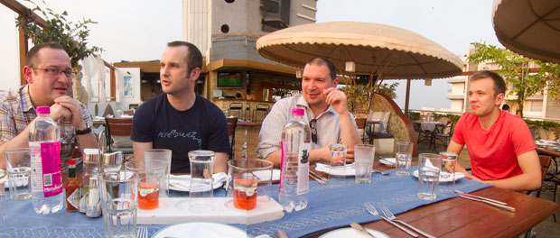 Malcolm Kadodwala, Eddie Cussen, Chris Syme, and Calum Jack having a beer after our long trip to Pune