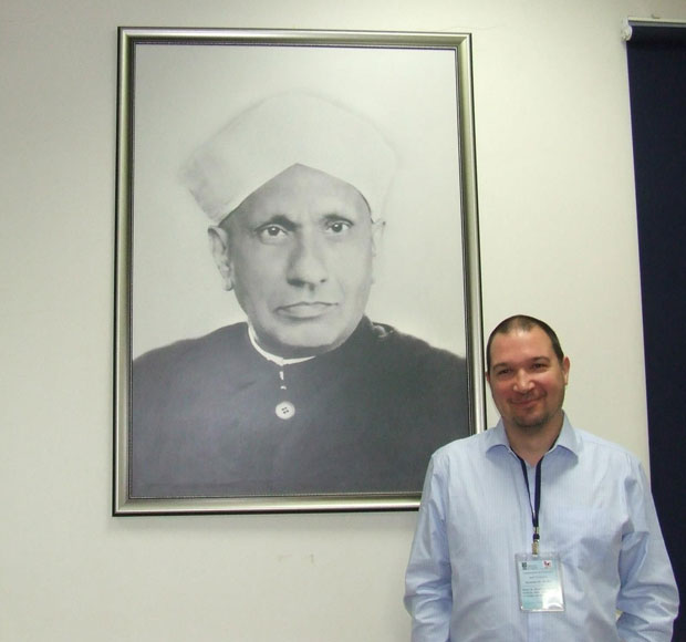 Cjris Syme under a photo of Raman
